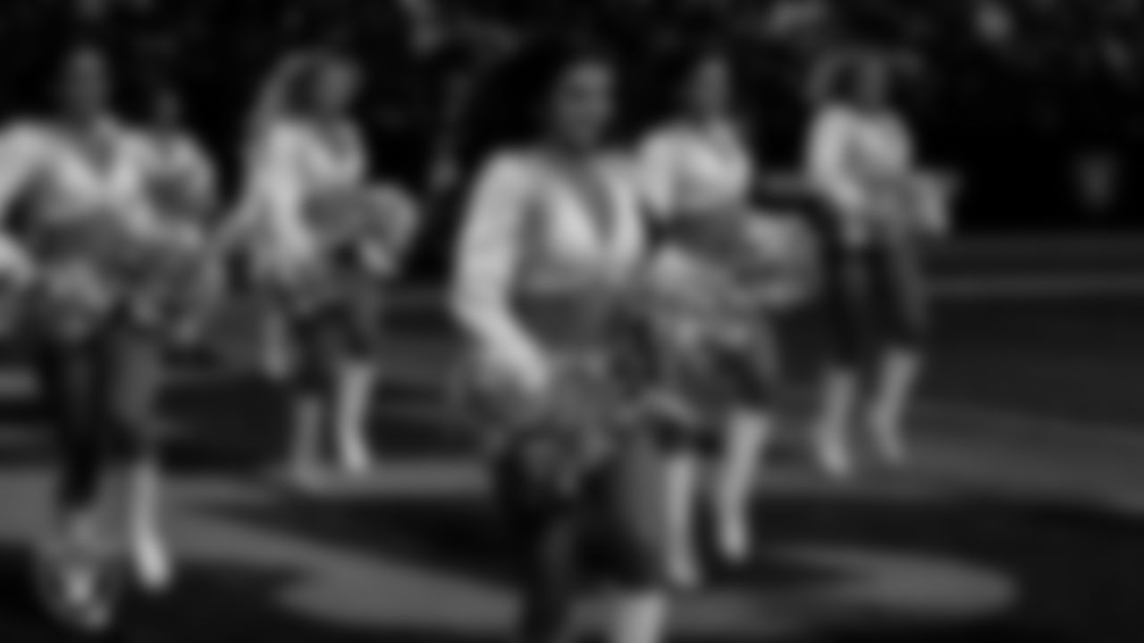 Raiderette Kylee walks onto the field for a performance during the regular season home game against the Kansas City Chiefs at Allegiant Stadium.