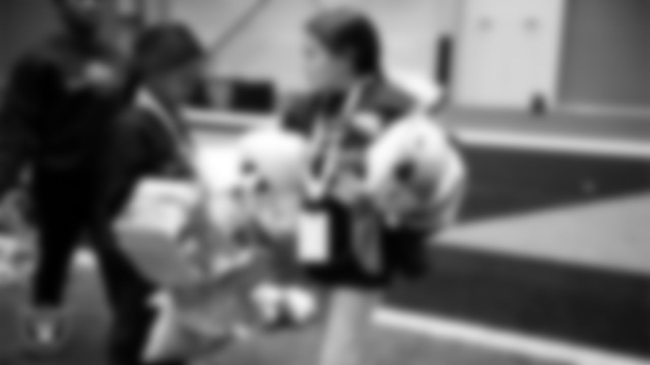 Students select toys during a Raiders Youth Holiday Party at Intermountain Health Performance Center.