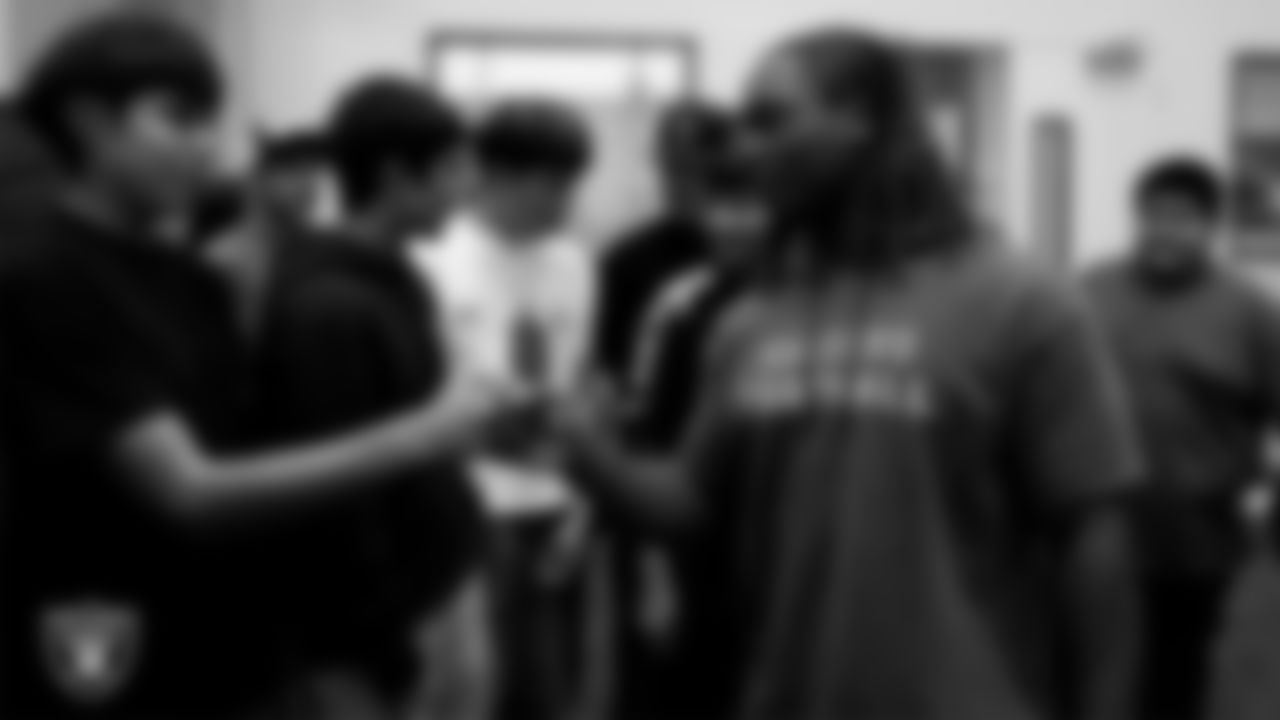Las Vegas Raiders running back Ashton Jeanty (2) meets with the Owyhee High School football team during a walkthrough at Intermountain Health Performance Center.