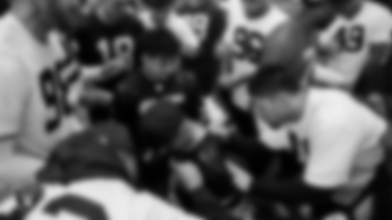 Marcos Carrillo and Christopher Arias from Make-A-Wish get their jerseys signed after practice during a visit to Intermountain Health Performance Center.