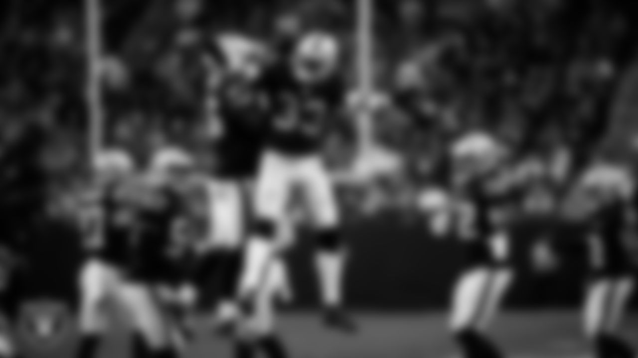 Las Vegas Raiders linebacker Devin White (45) and linebacker Jamal Adams (33) celebrate on the field during the regular season home game against the Kansas City Chiefs at Allegiant Stadium.