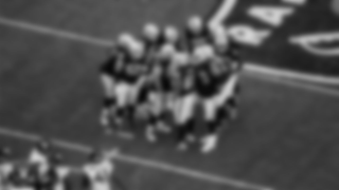 The Las Vegas Raiders offense huddles during the regular season home game against the Jacksonville Jaguars at Allegiant Stadium.