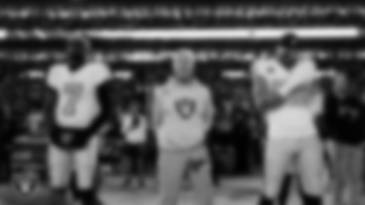 Las Vegas Raiders quarterback Geno Smith (7), Head Coach Pete Carroll and defensive end Maxx Crosby (98) during the national anthem before the regular season away game against the Denver Broncos at Empower Field at Mile High.