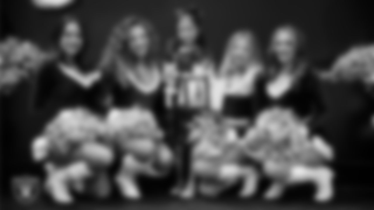 Raiderettes pose for a photo with a Junior Raiderette during the Junior Raiderettes Banquet at The Studio.