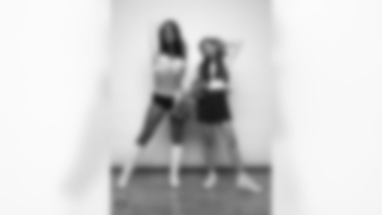 Raiderette Reagan poses for a photo with a Junior Raiderette during 2025 Media Day at The Studio.