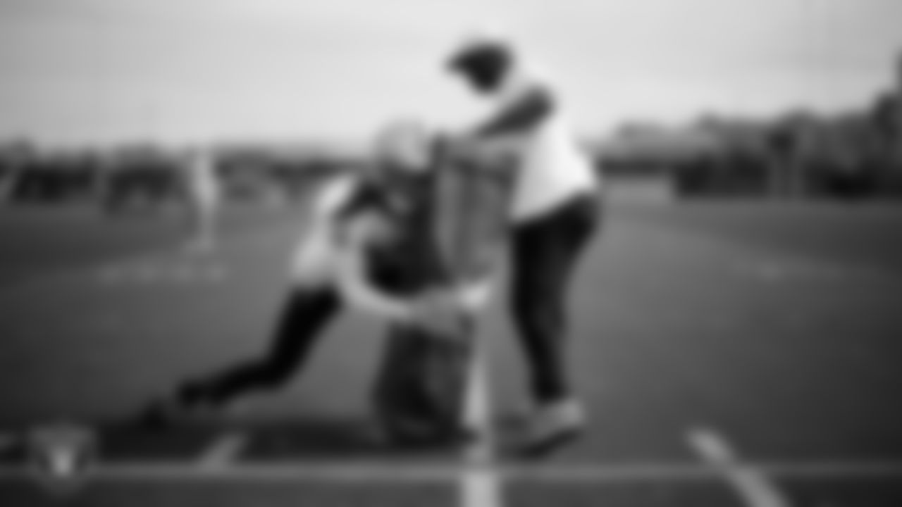 Las Vegas Raiders cornerback Eric Stokes (22) and pass game coordinator/defensive backs coach Joe Woods during practice at Intermountain Health Performance Center.