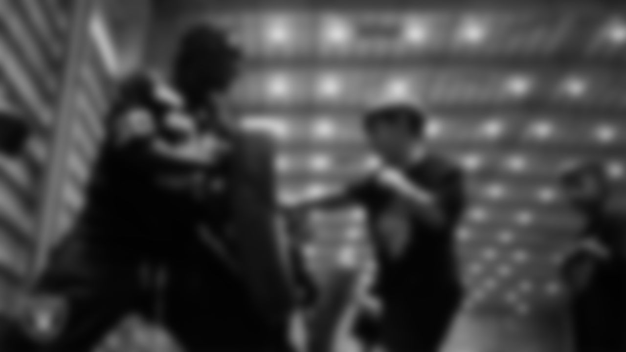 Las Vegas Raiders cornerback Darnay Holmes (30) works through drills with students during the Raiders Jr. Training Camp x Camp Bruce Lee event at Intermountain Health Performance Center.