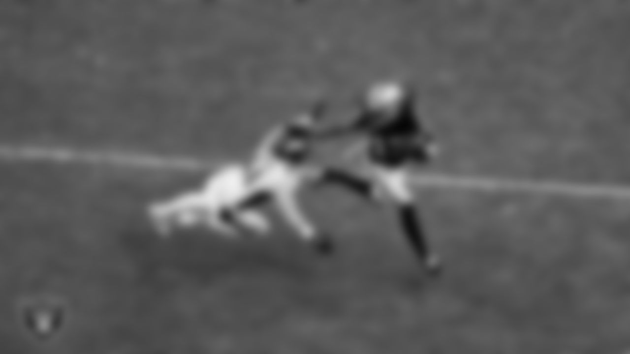 Las Vegas Raiders wide receiver Davante Adams (17) runs after making a catch during the regular season home game against the Denver Broncos at Allegiant Stadium.