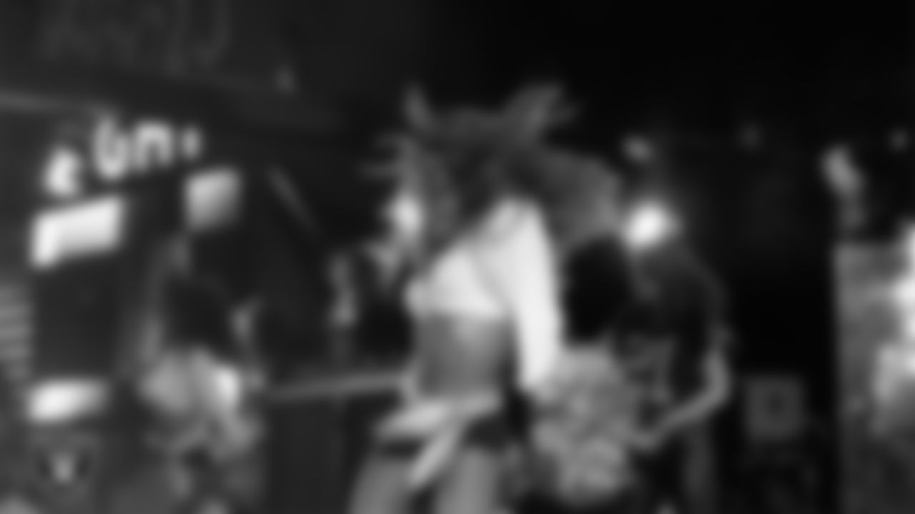 Raiderette Lexie performs with rapper and record producer Lil Jon during halftime at the regular season home game against the Los Angeles Chargers at Allegiant Stadium.