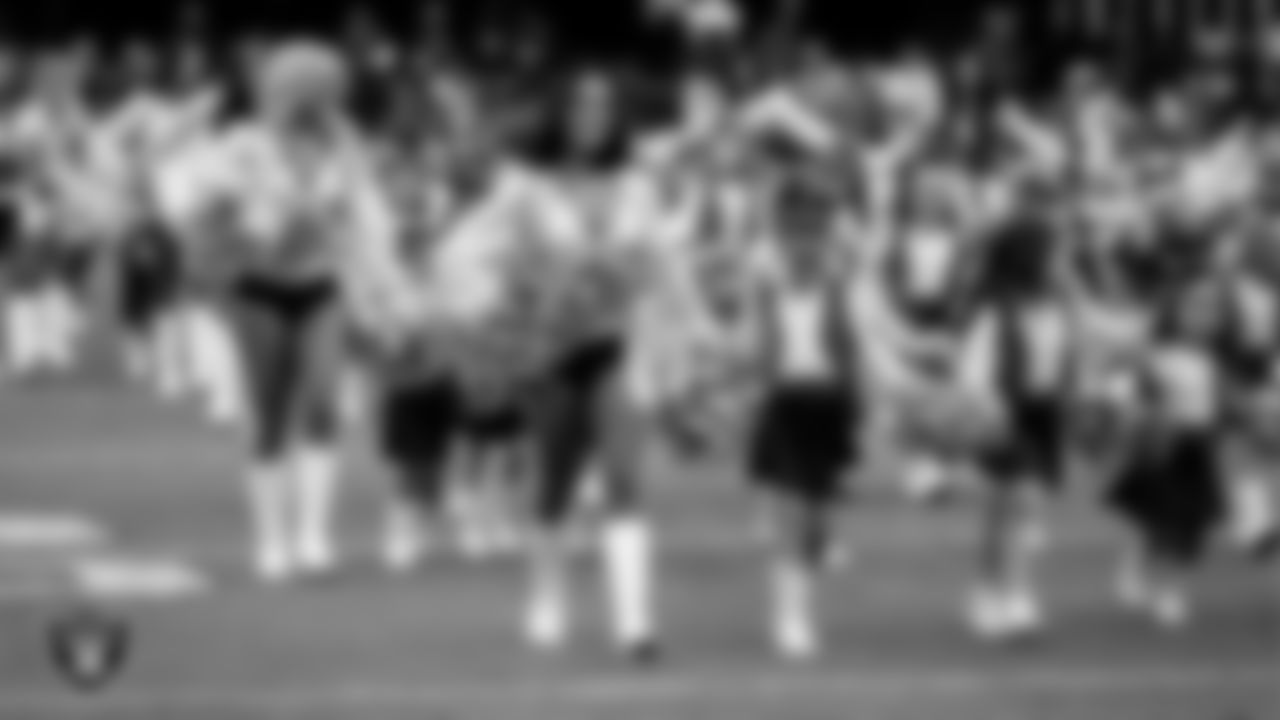 Raiderette Kylie and Junior Raiderettes enter the field for their performance on the field before the preseason home game against the San Francisco 49ers at Allegiant Stadium.
