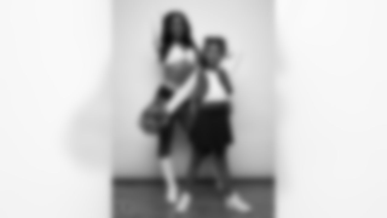 Raiderette Cierra poses for a photo with a Junior Raiderette during 2025 Media Day at The Studio.