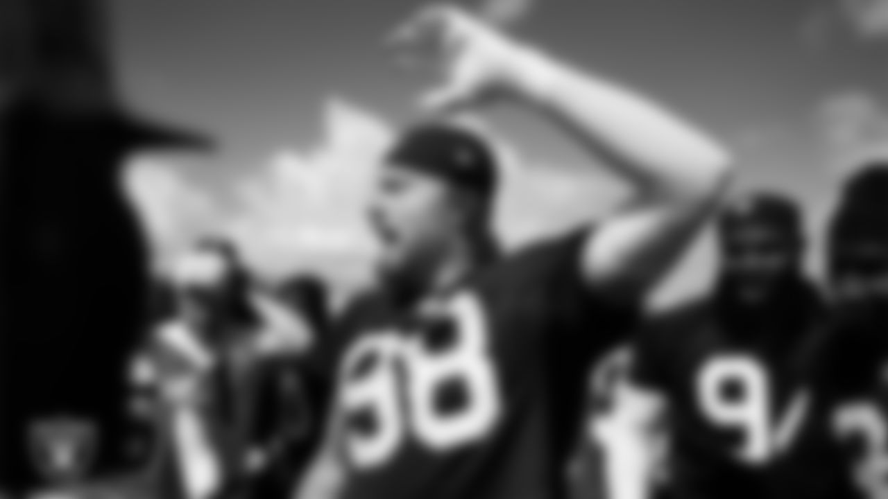 Las Vegas Raiders defensive end Maxx Crosby (98) leads a huddle at a workout during phase two of the offseason program at Intermountain Health Performance Center.