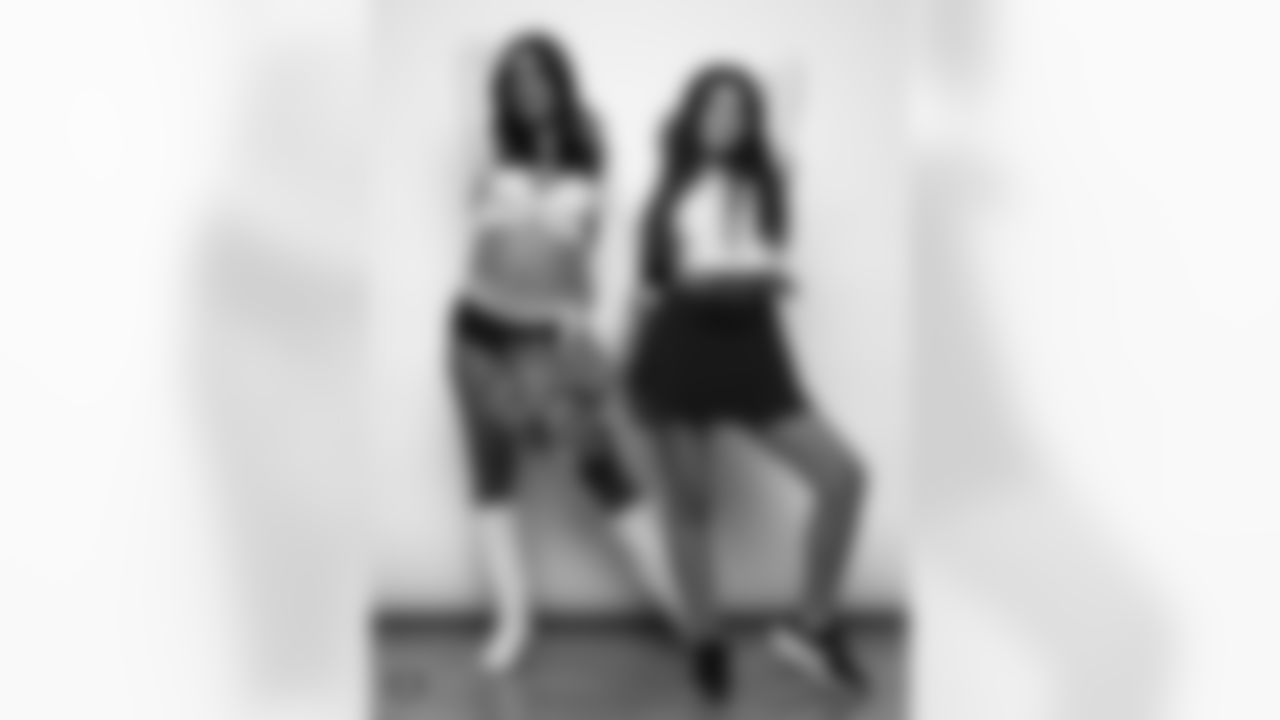 Raiderette Reagan poses for a photo with a Junior Raiderette during 2025 Media Day at The Studio.