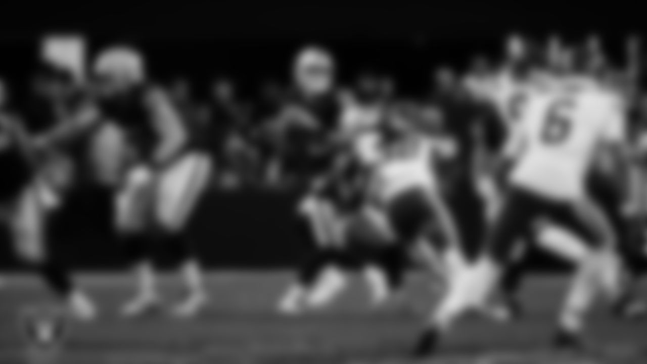 Las Vegas Raiders quarterback Aidan O'Connell (12) looks for a receiver during the regular season home game against the Kansas City Chiefs at Allegiant Stadium.