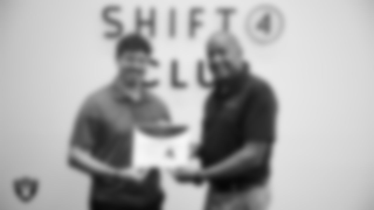 Winner Tyler Stinson of Cookie Cutter Haircuts and Shift4 marketing project manager Howard Fawcett pose for a photo during the 2025 Small Business Showcase at Allegiant Stadium.