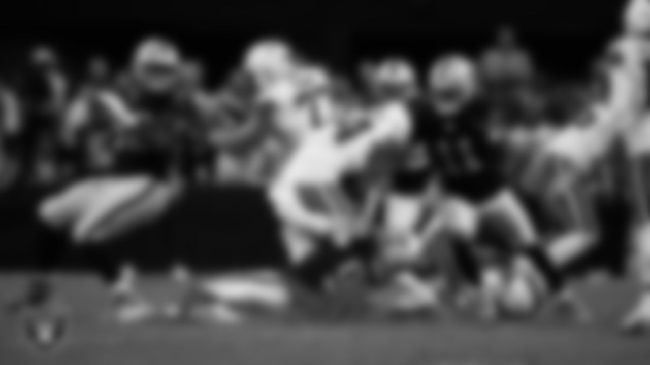 Las Vegas Raiders defensive end Maxx Crosby (98) makes a tackle during the regular season home game against the Cleveland Browns at Allegiant Stadium.