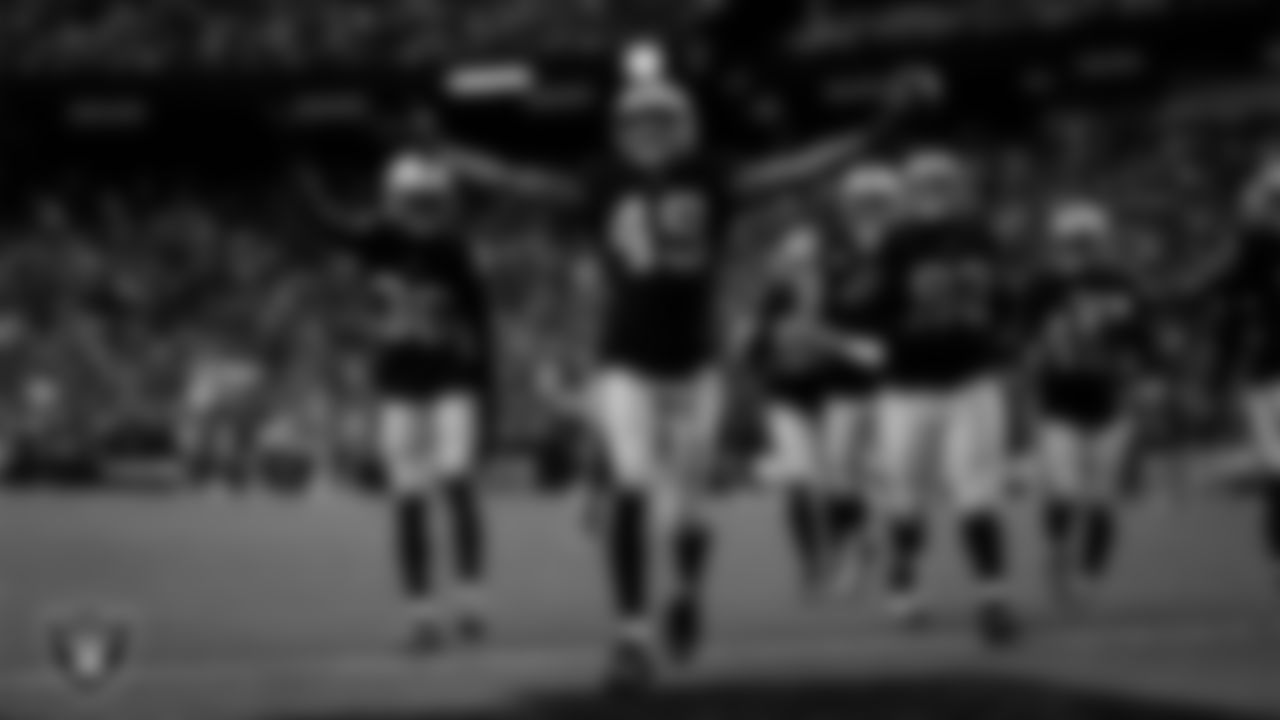 Las Vegas Raiders defensive end Charles Snowden (49) celebrates after making an interception during the regular season home game against the Cleveland Browns at Allegiant Stadium.