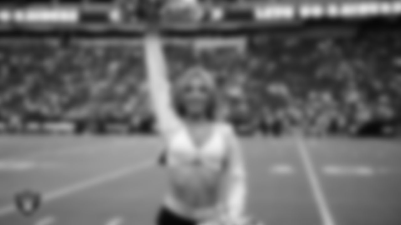 Raiderette Hayley on the sidelines during a 2025 Training Camp mock game at Allegiant Stadium.