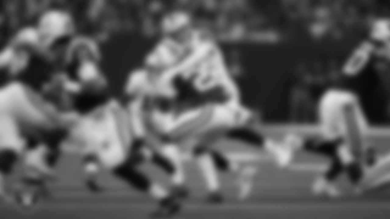 Las Vegas Raiders defensive end Maxx Crosby (98) makes a tackle during the regular season away game against the Indianapolis Colts at Lucas Oil Stadium.