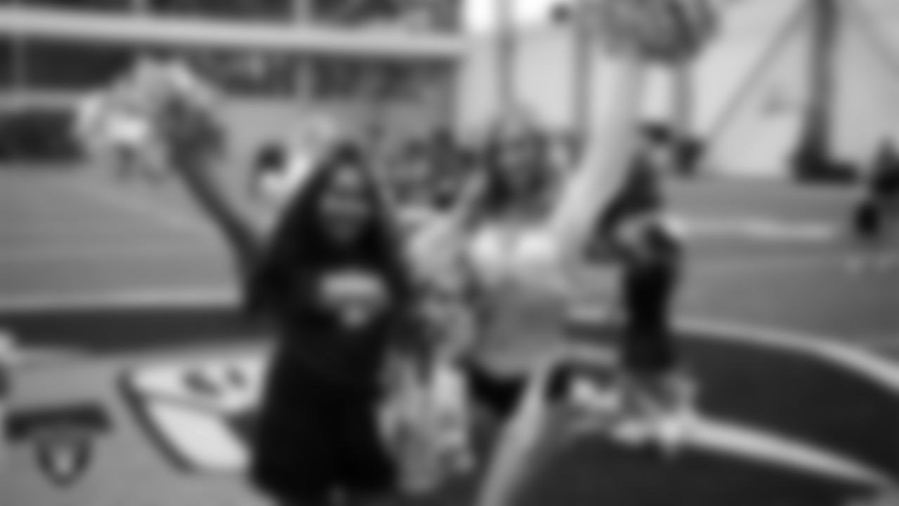 Raiderette Taylor poses for a photo with a dancer during day three of summer camp at Intermountain Health Performance Center.