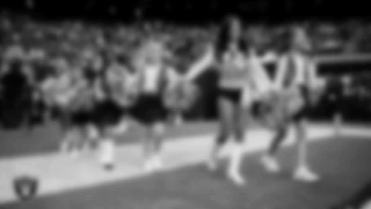 Raiderette Tatiana and Junior Raiderettes enter the field for their performance on the field before the preseason home game against the San Francisco 49ers at Allegiant Stadium.