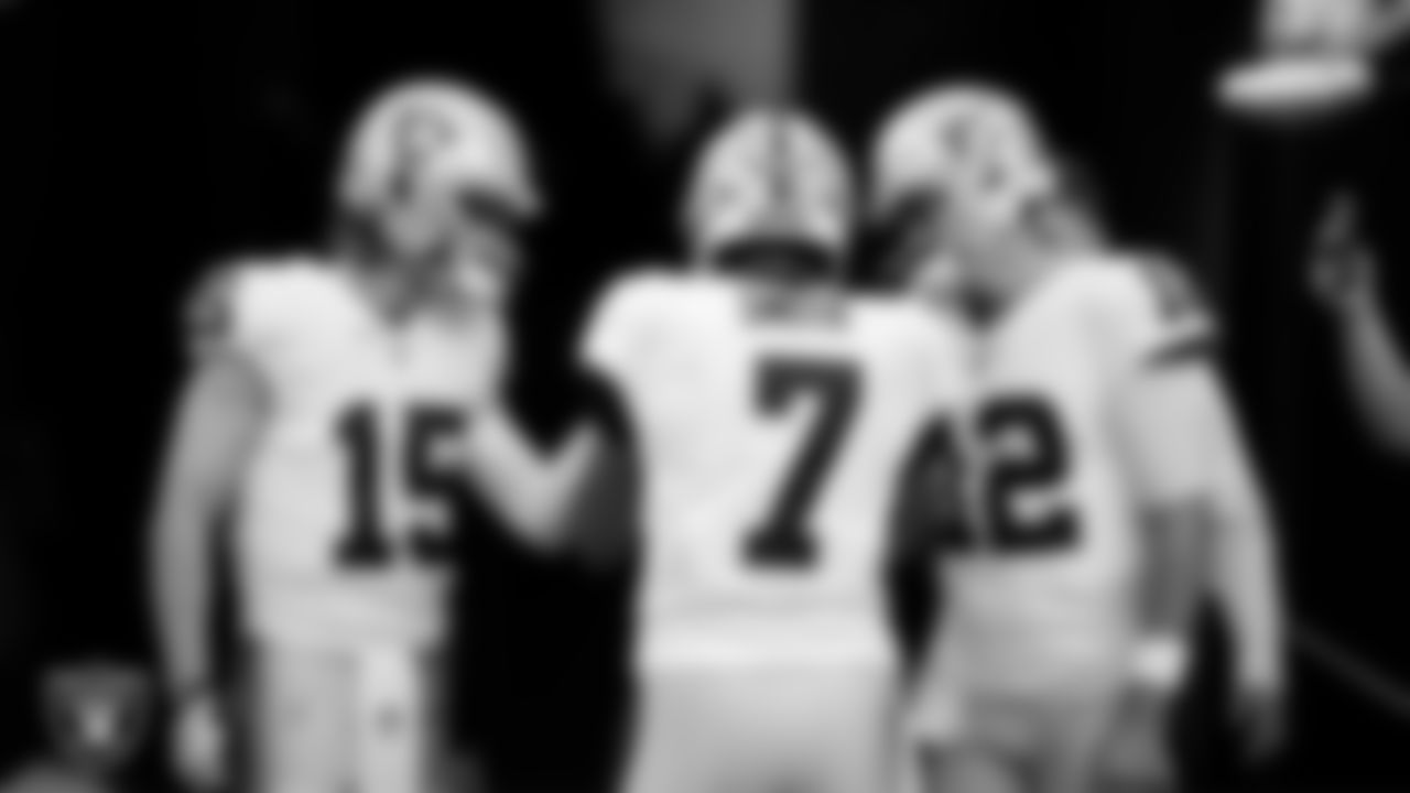 The Las Vegas Raiders quarterbacks huddle in the tunnel before the regular season away game against the Houston Texans at NRG Stadium.
