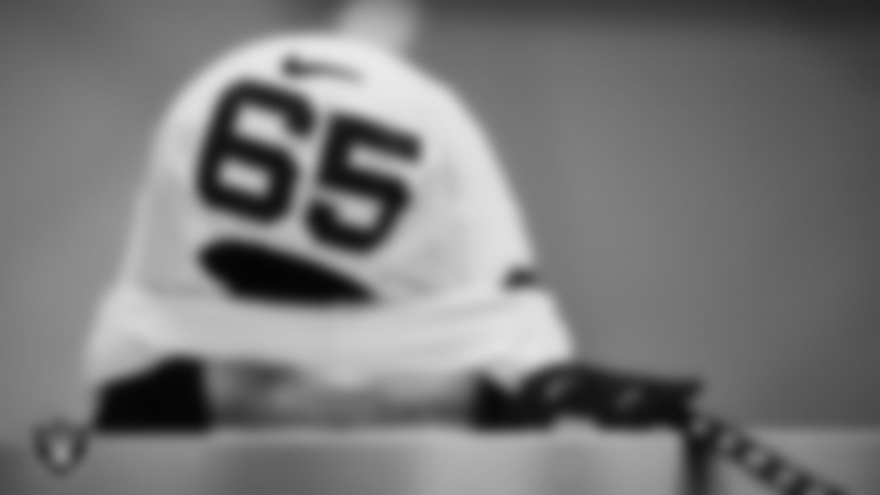 Las Vegas Raiders guard Alex Cappa's (65) pads in the locker room prior to the Raiders' arrival for their regular season away game against the Los Angeles Chargers at SoFi Stadium.