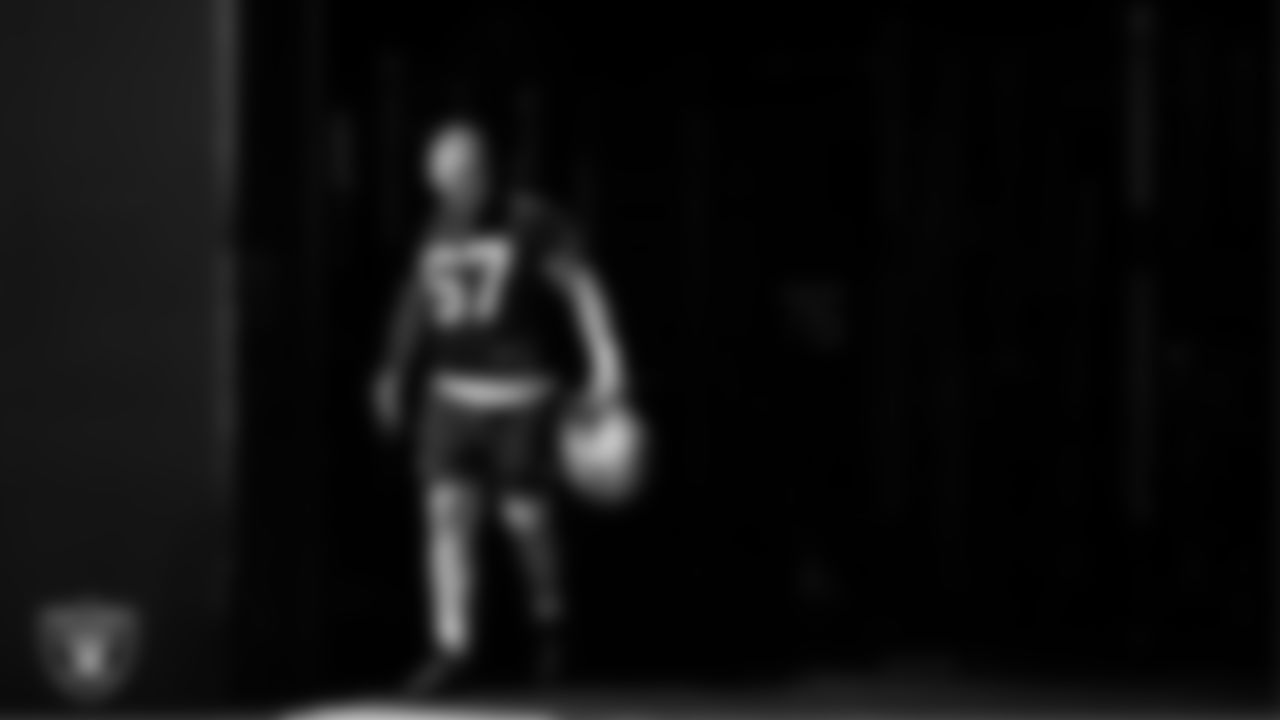 Las Vegas Raiders center Will Putnam (67) walks out to the field for practice at Intermountain Health Performance Center.