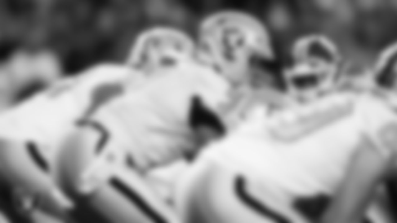 Las Vegas Raiders quarterback Geno Smith (7) lines up before the snap during the regular season away game against the Denver Broncos at Empower Field at Mile High.