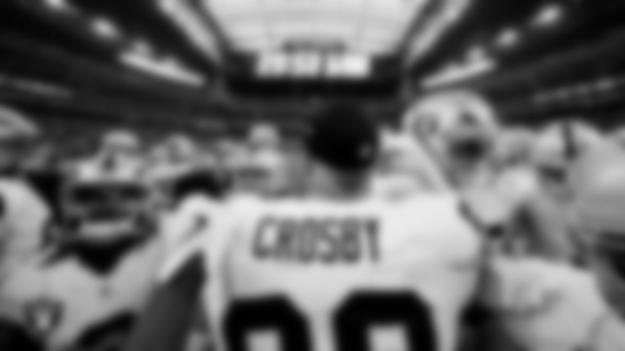 The Las Vegas Raiders huddle before the regular season away game against the Houston Texans at NRG Stadium.