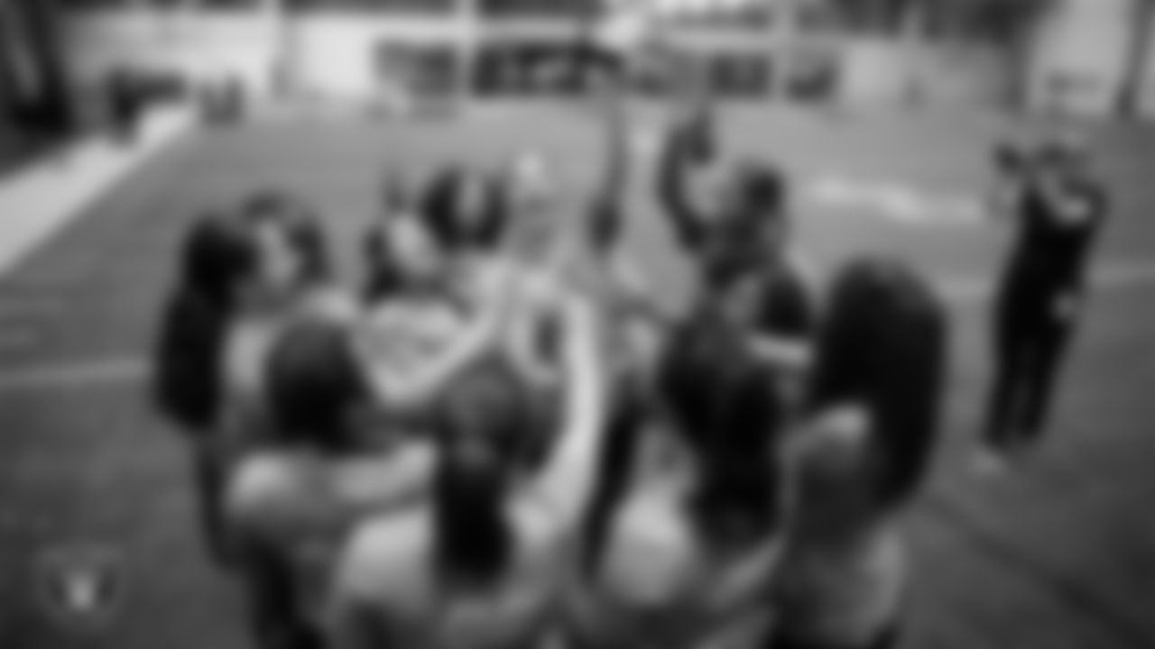 Athletes celebrate after winning the Silver and Black Championship game during Play Football Day at Intermountain Health Performance Center.