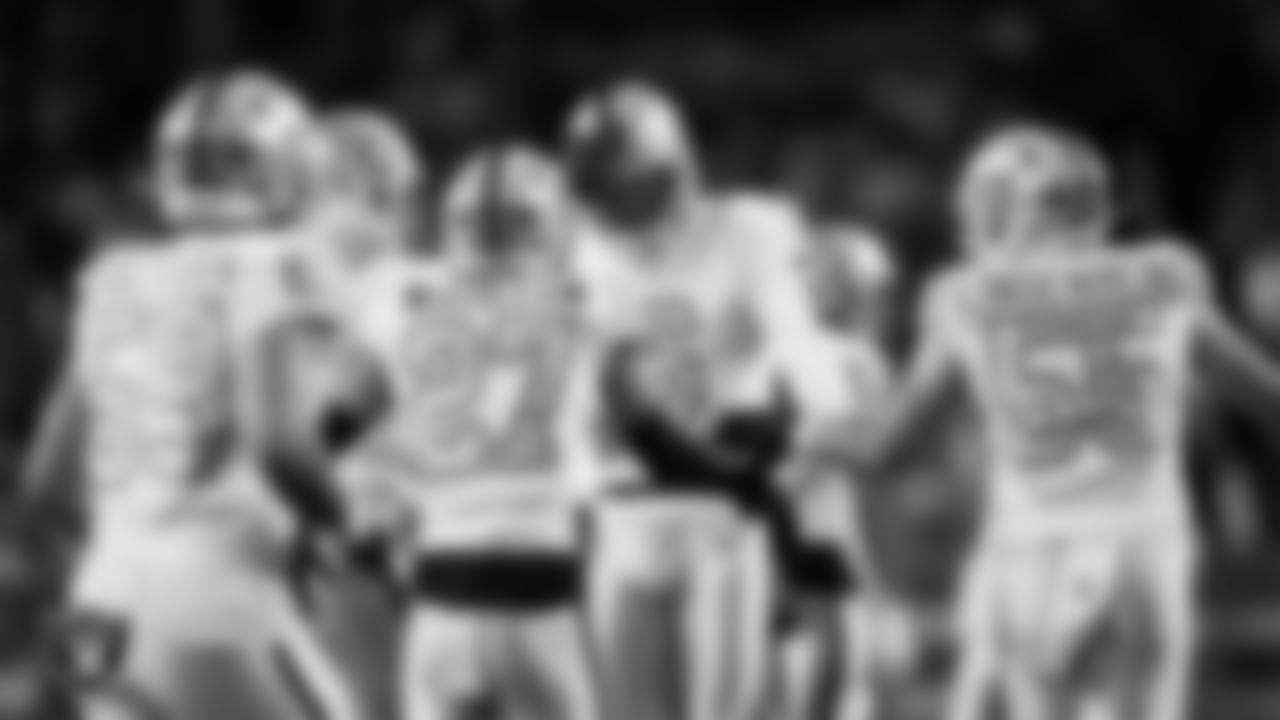 Las Vegas Raiders punter AJ Cole (6) celebrates with teammates after punting during the regular season away game against the Denver Broncos at Empower Field at Mile High.