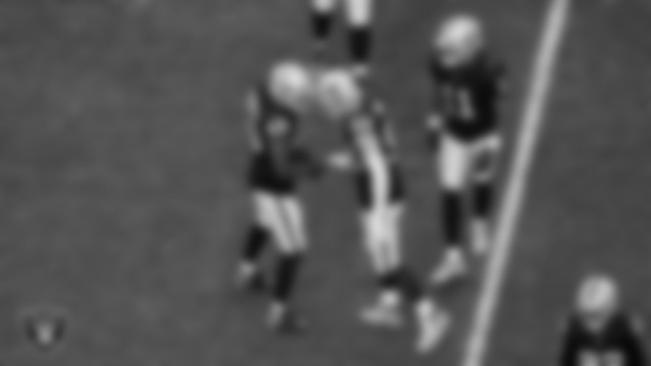 Las Vegas Raiders defensive end Charles Snowden (49) celebrates with defensive end Maxx Crosby (98) after making a tackle during the regular season home game against the Cleveland Browns at Allegiant Stadium.