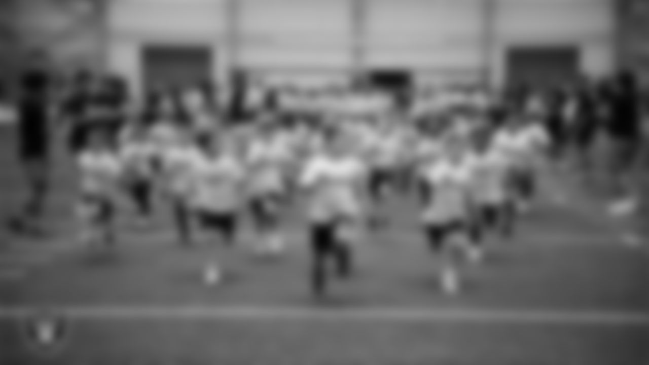 Athletes participate in a skills camp during Play Football Day at Intermountain Health Performance Center.