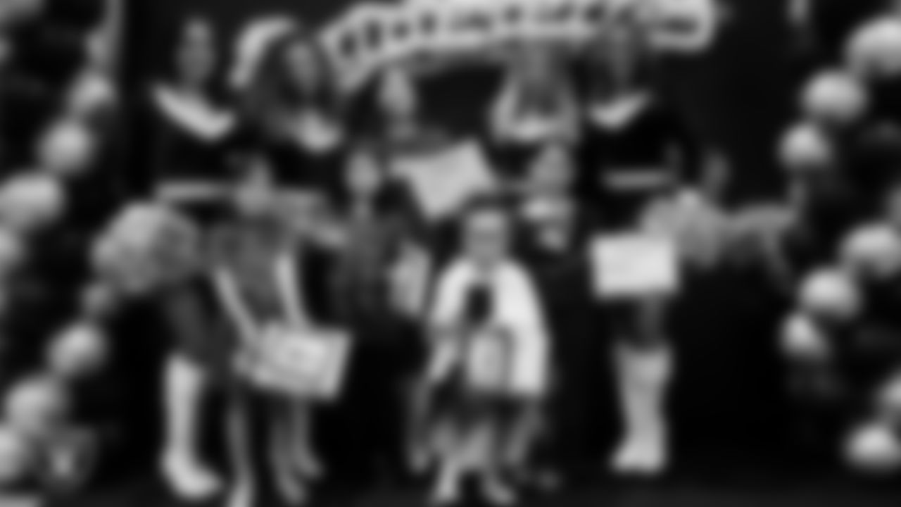 Raiderettes pose for a photo with Junior Raiderettes during the Junior Raiderettes Banquet at The Studio.