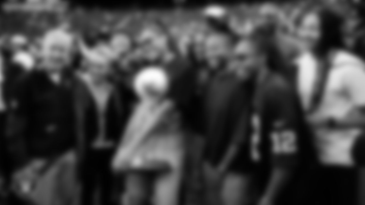 Las Vegas Raiders Head Coach Pete Carroll poses for a photo with members of the Las Vegas Aces and the Commissioner's Cup Trophy before the Raiders' regular season home game against the Tennessee Titans at Allegiant Stadium.