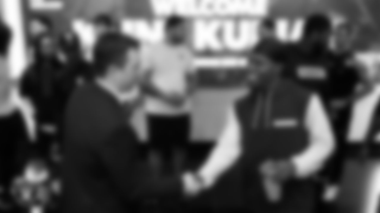 Las Vegas Raiders cornerback Darnay Holmes (30) welcomes Raiders Head Coach Klint Kubiak to Intermountain Health Performance Center.