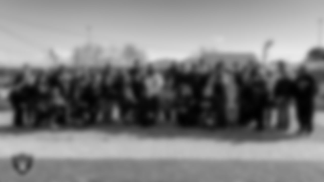 Attendees pose for a photo at the Obodo Community Gardens during the Historic Westside Tour.