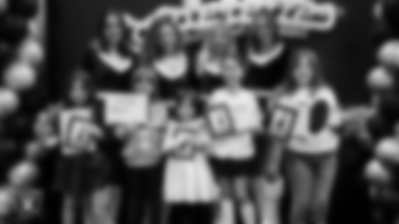 Raiderettes pose for a photo with Junior Raiderettes during the Junior Raiderettes Banquet at The Studio.