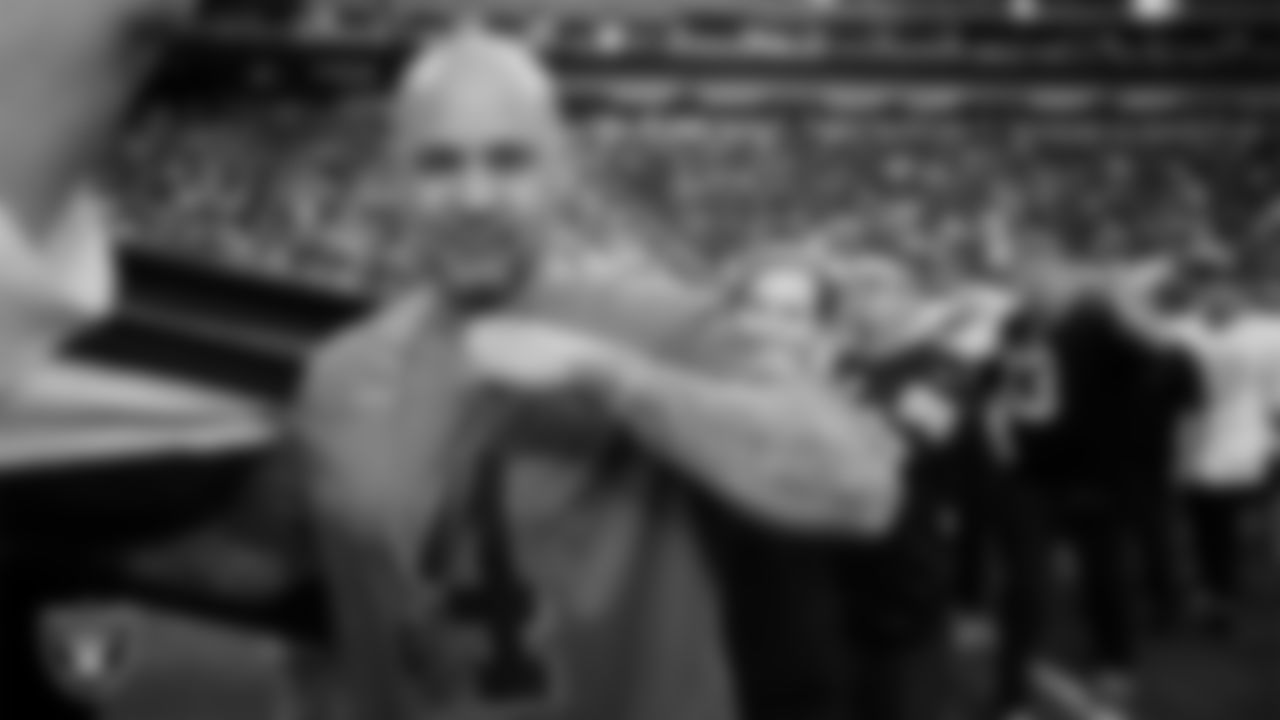 The American flag is displayed by Personal Seat License (PSL) holders on the field during the national anthem before the Las Vegas Raiders' regular season home game against the Jacksonville Jaguars at Allegiant Stadium.