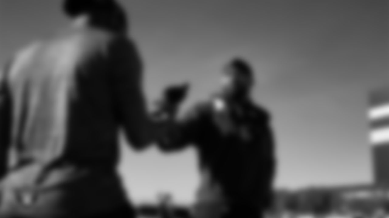 Las Vegas Raiders defensive quality control coach Beyah Rasool and linebacker Jamal Adams (33) during practice at Intermountain Health Performance Center.