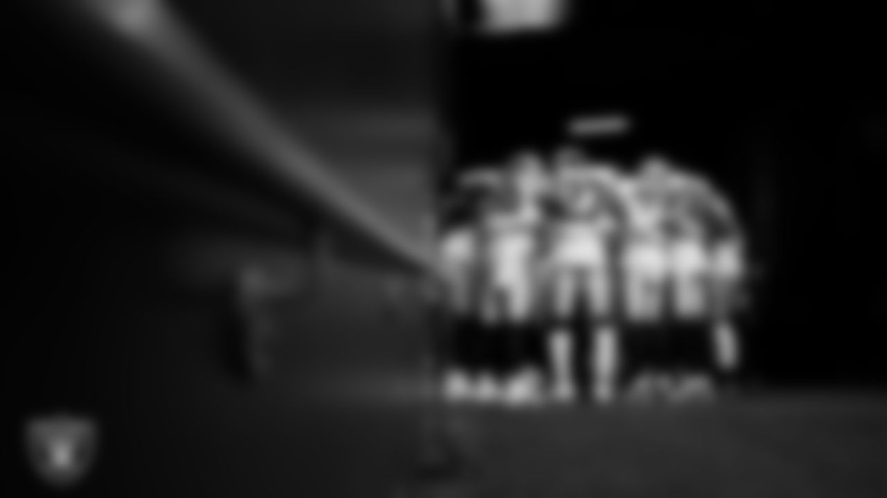 The Las Vegas Raiders defensive backs huddle in the tunnel before the preseason away game against the Seattle Seahawks at Lumen Field.