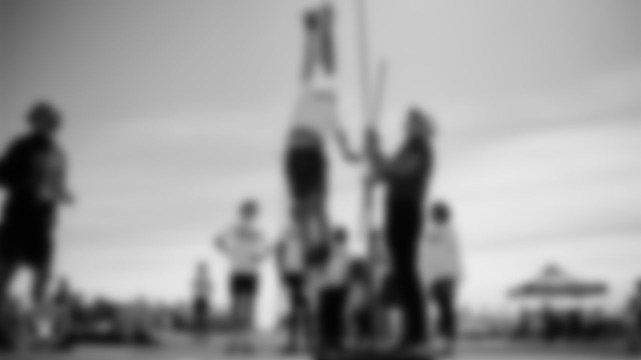 An athlete goes through a drill during a youth football combine at Durango High School.