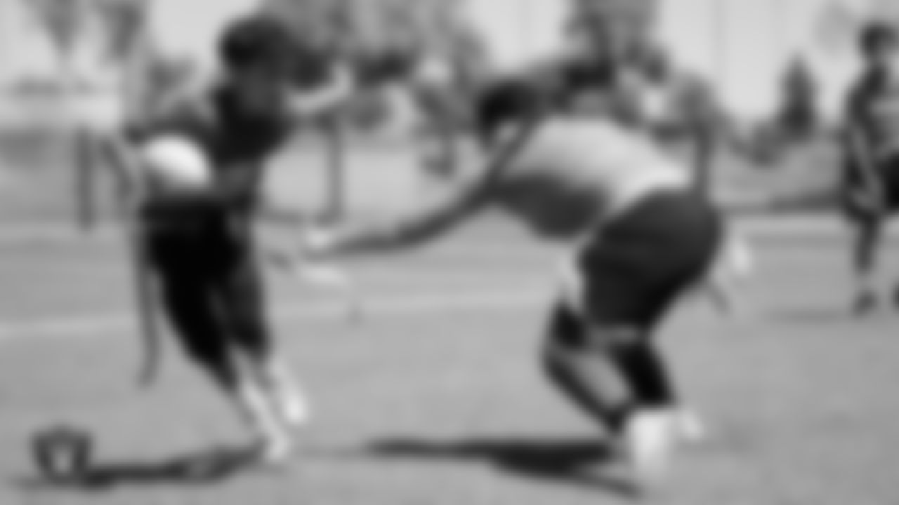 Athletes compete in a Silver and Black Flag Football game at Bill and Lillie Heinrich YMCA.