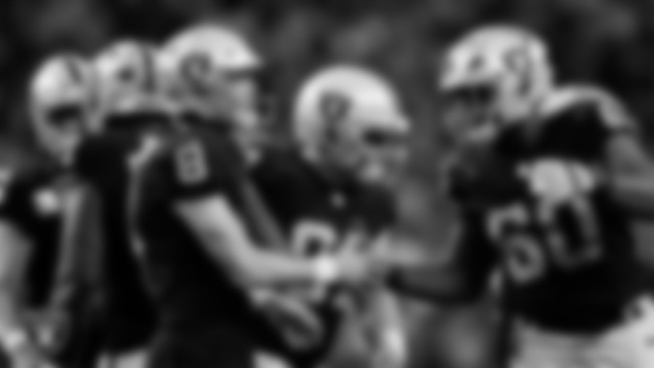 Las Vegas Raiders kicker Daniel Carlson (8) celebrates with tackle Charles Grant (60) after kicking a 32-yard field goal during the regular season home game against the Kansas City Chiefs at Allegiant Stadium.