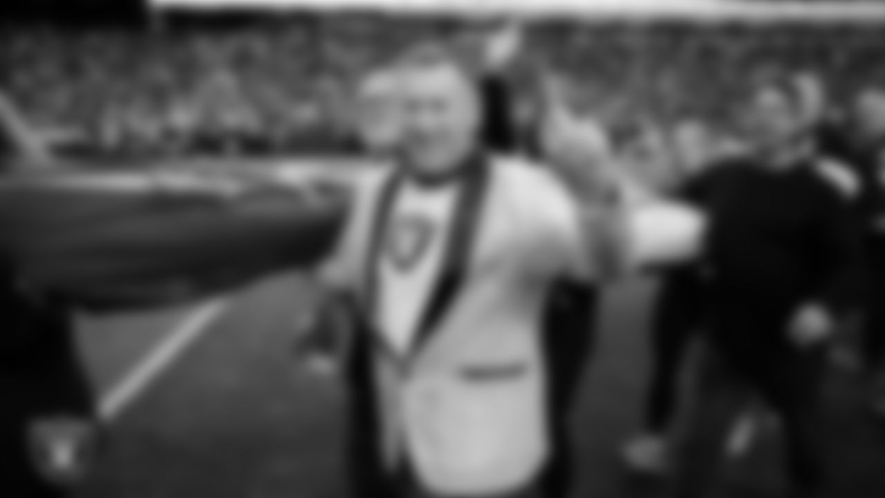 The American flag is displayed by Personal Seat License (PSL) holders on the field during the national anthem before the Las Vegas Raiders' regular season home game against the New York Giants at Allegiant Stadium.