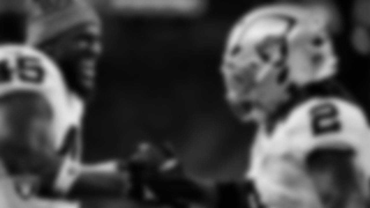 Las Vegas Raiders running back Ashton Jeanty (2) celebrates with linebacker Devin White (45) after making a 60-yard touchdown catch during the regular season away game against the Houston Texans at NRG Stadium.