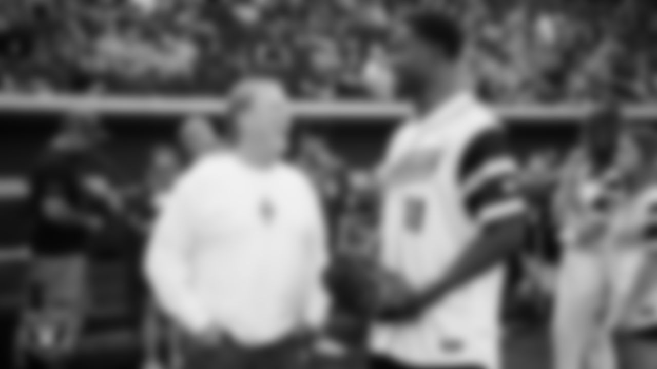 Las Vegas Raiders Owner Mark Davis talks with safety Jeremy Chinn (11) before the softball game during the Battle For Vegas at Las Vegas Ballpark.