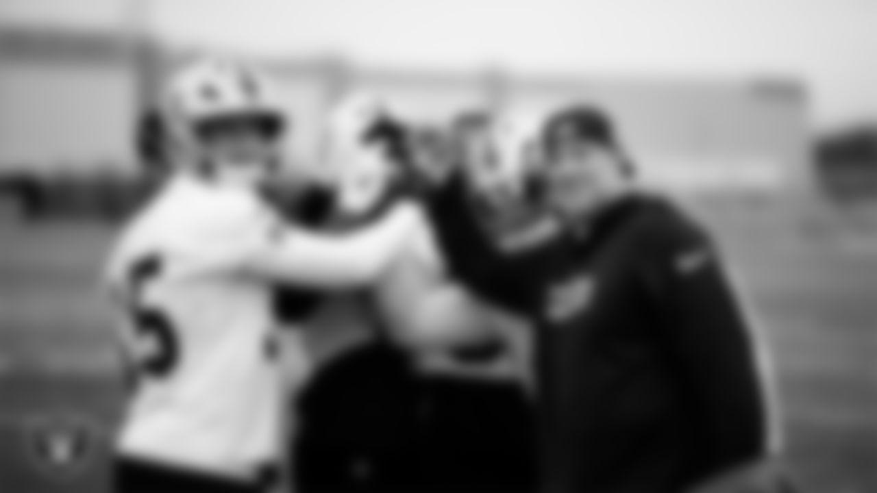 The Las Vegas Raiders linebackers huddle during practice at Intermountain Health Performance Center.