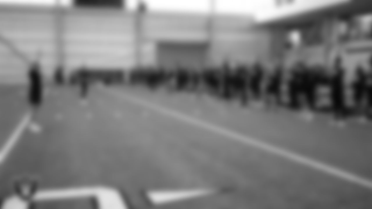 Athletes warmup during Raiders ELITE Academy at Las Vegas Raiders Headquarters.